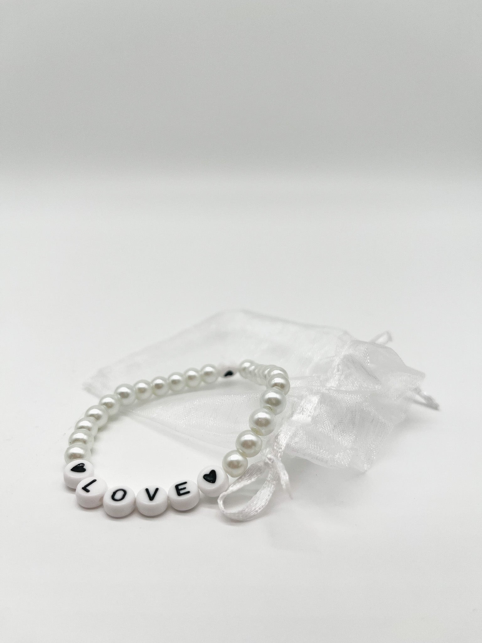 One World | Perlenarmband - Empovver